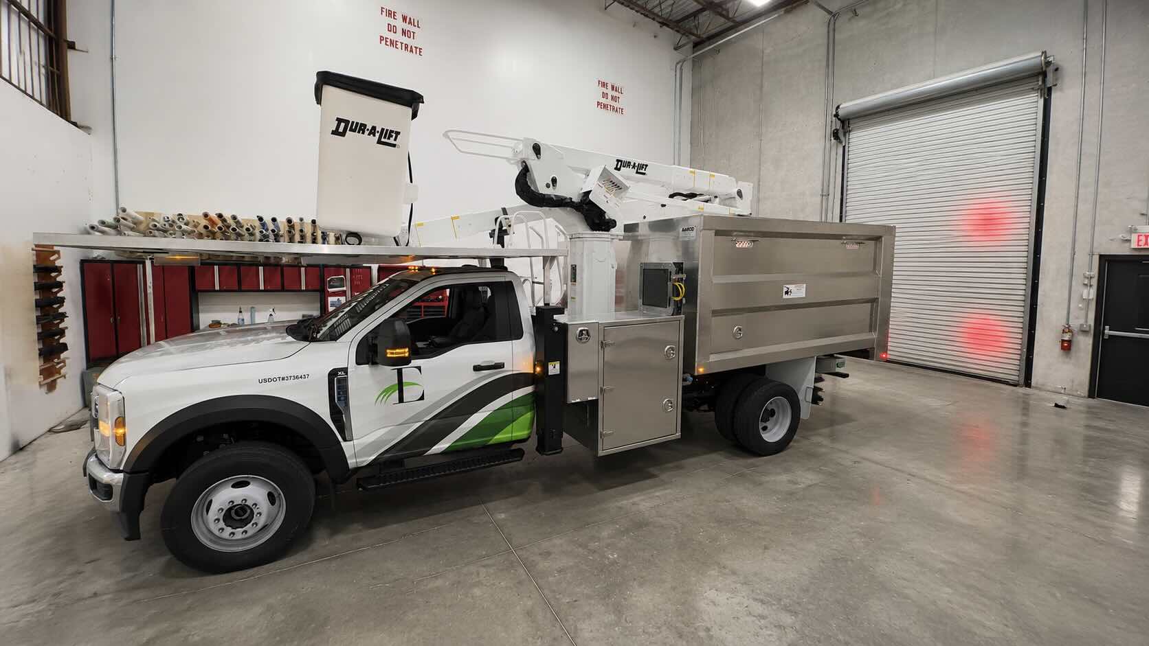 CRD Wraps facility in Royal Palm Beach — fleet wrap installation bay