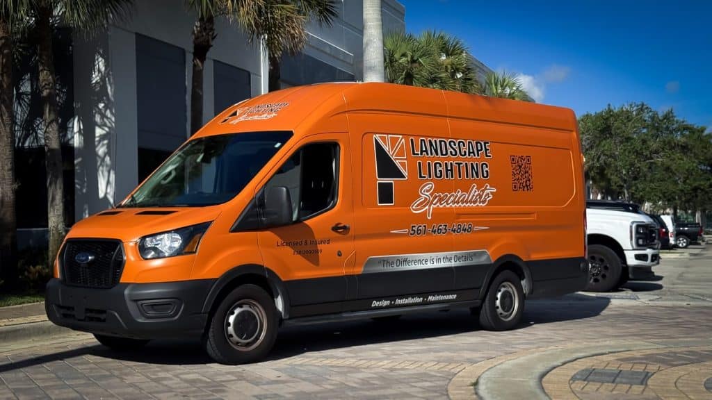 Front three-quarter view of Landscape Lighting Specialists custom Ford Transit commercial wrap