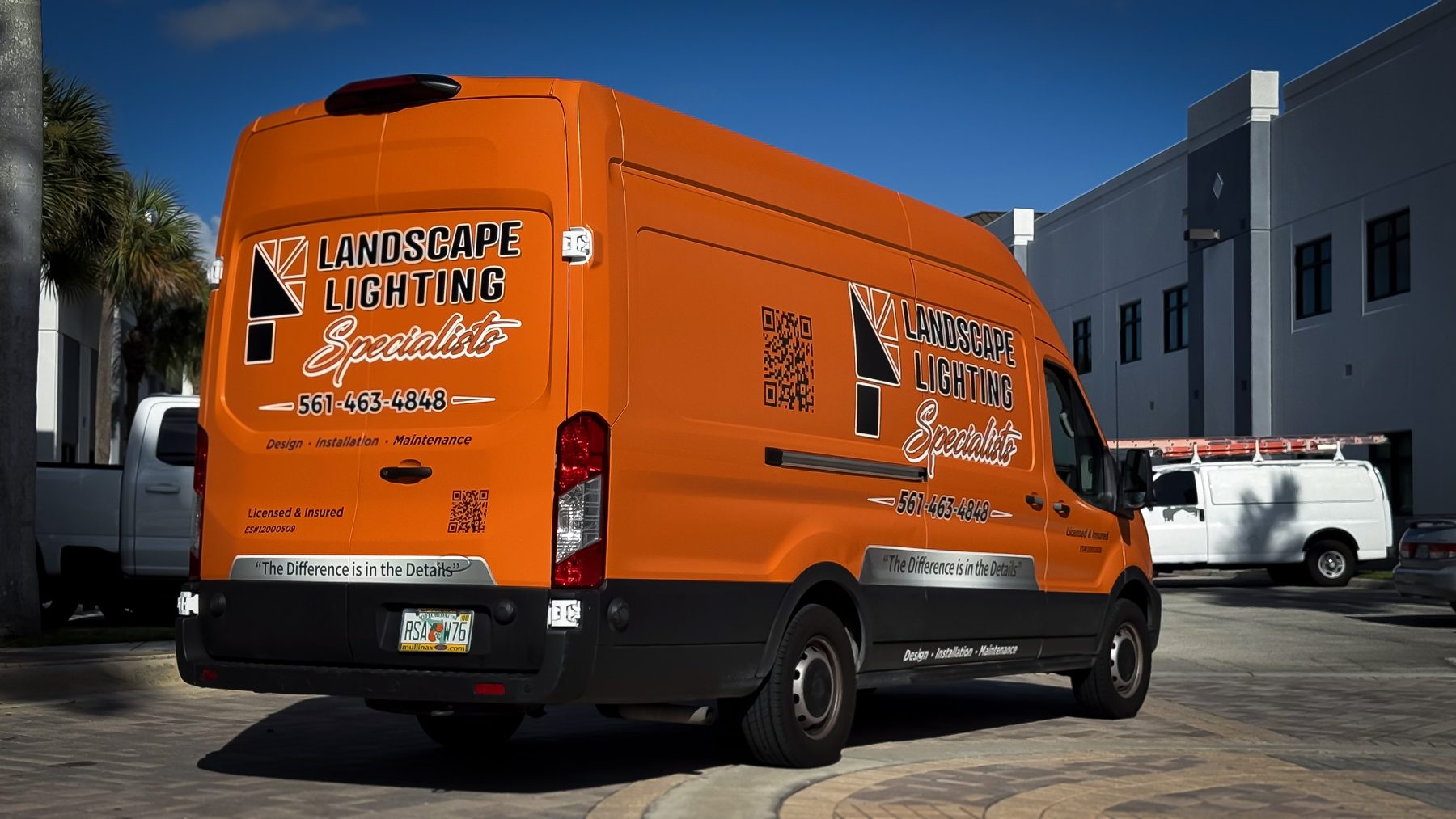 Rear and passenger-side branding on Landscape Lighting Specialists Ford Transit fleet wrap