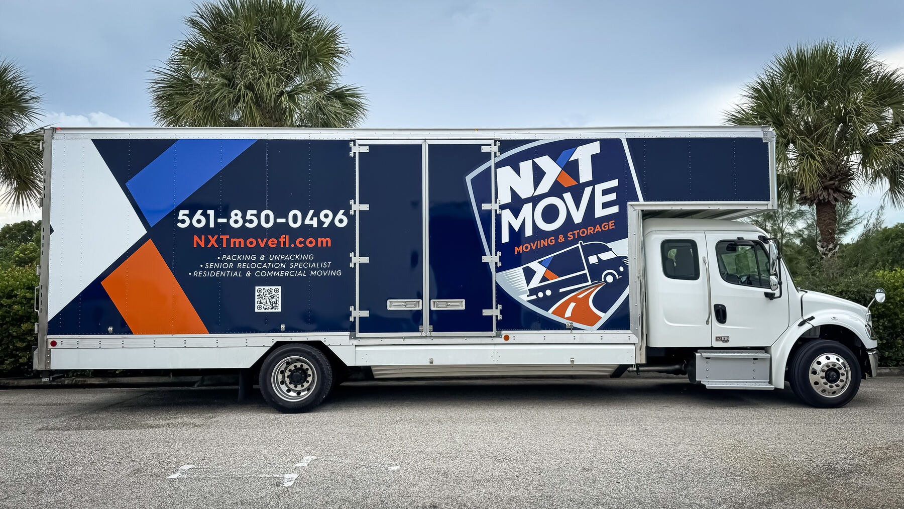 Full side profile of NXT Move commercial moving company box truck graphics