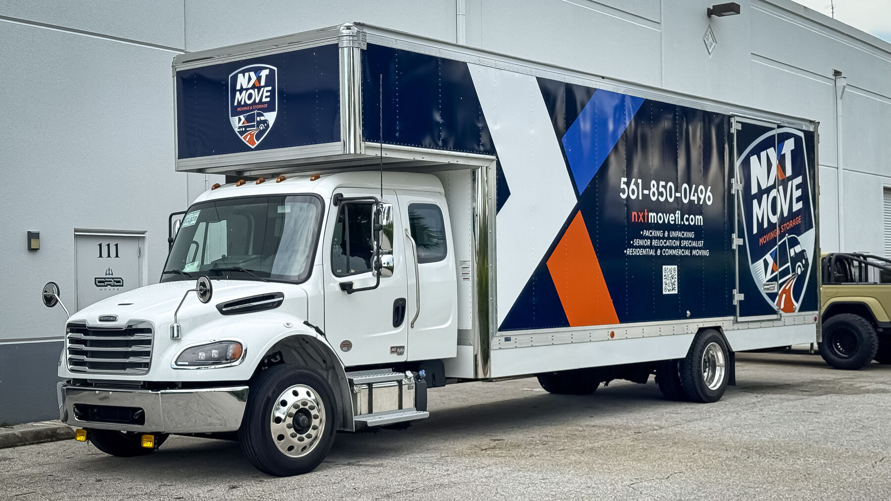 Finished NXT Move Moving & Storage 26-foot commercial box truck wrap in Palm Beach County