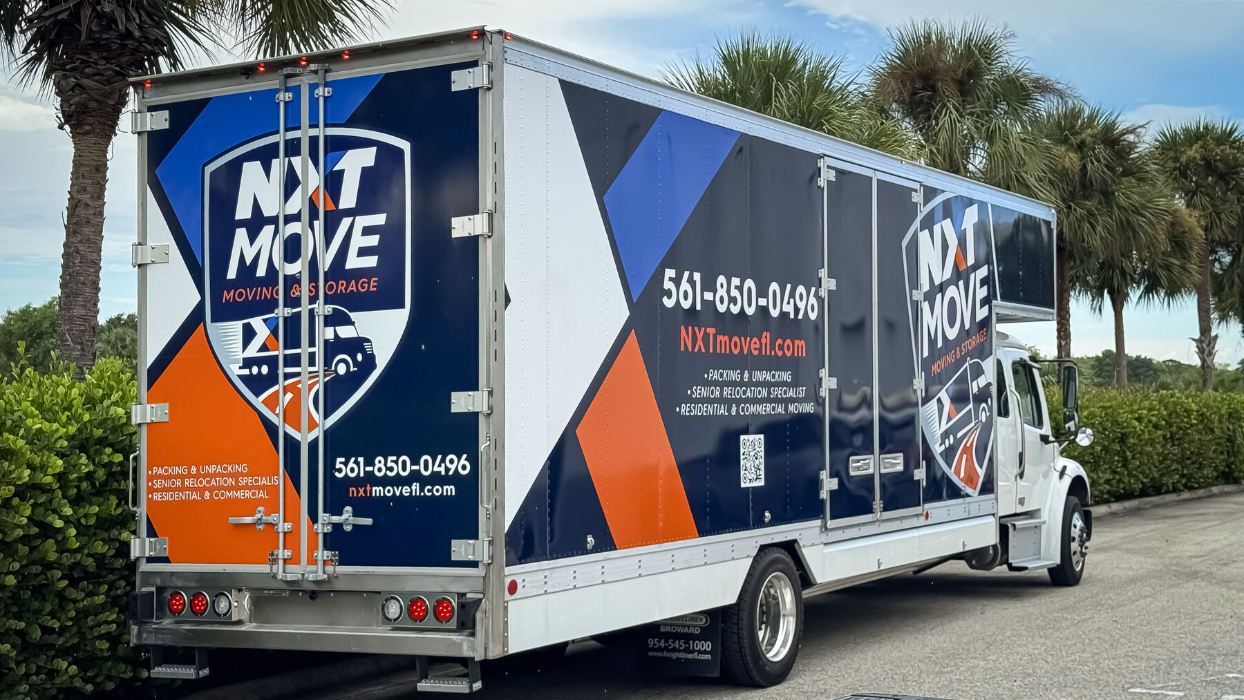 After: rear and side branding on the finished NXT Move commercial moving truck wrap